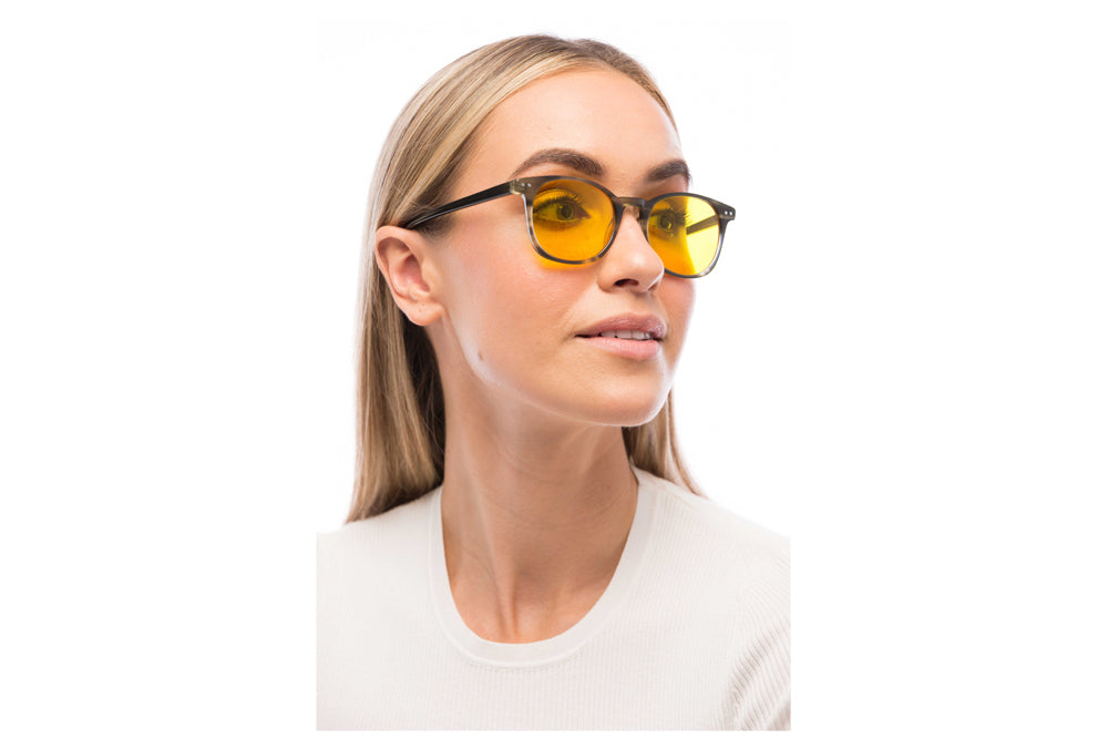 Woman Wearing Arrow Light Sensitivity Glasses Prescription