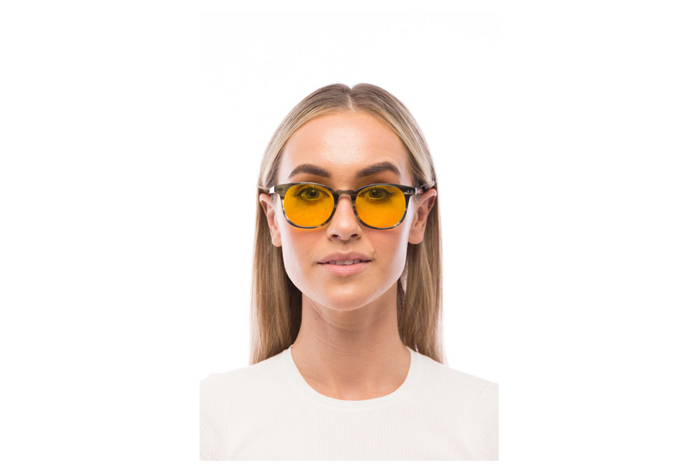 Woman Wearing Arrow Light Sensitivity Glasses Readers
