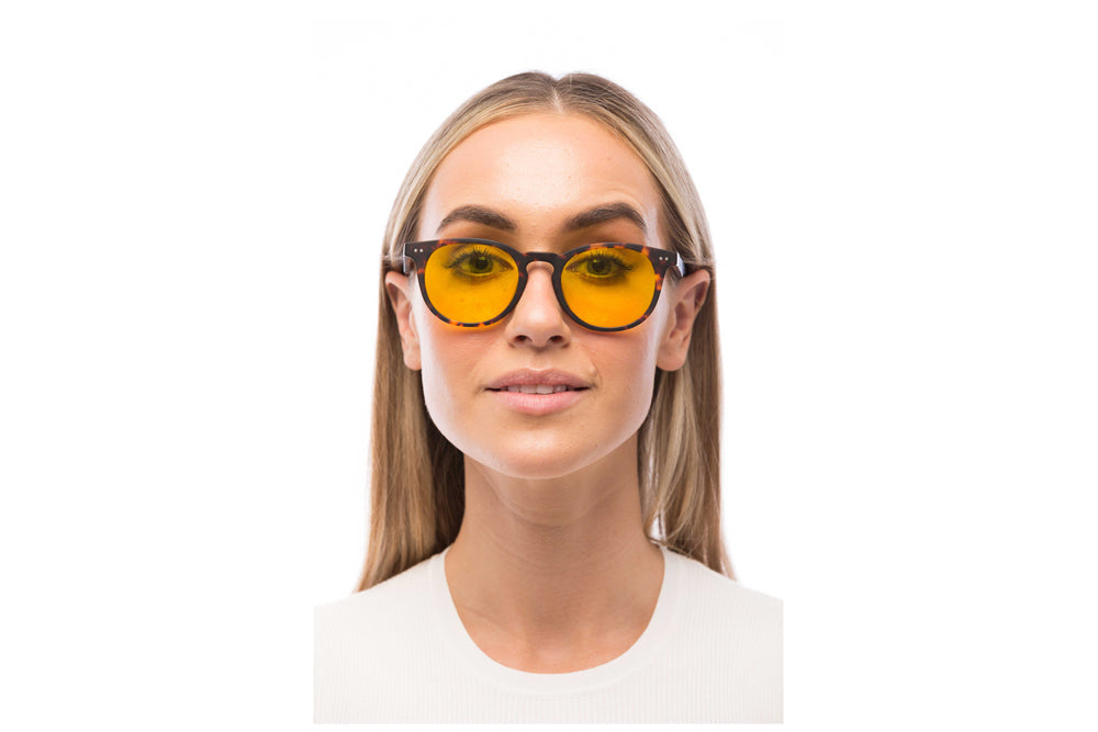 Woman Wearing Clarke Light Sensitivity Glasses Readers