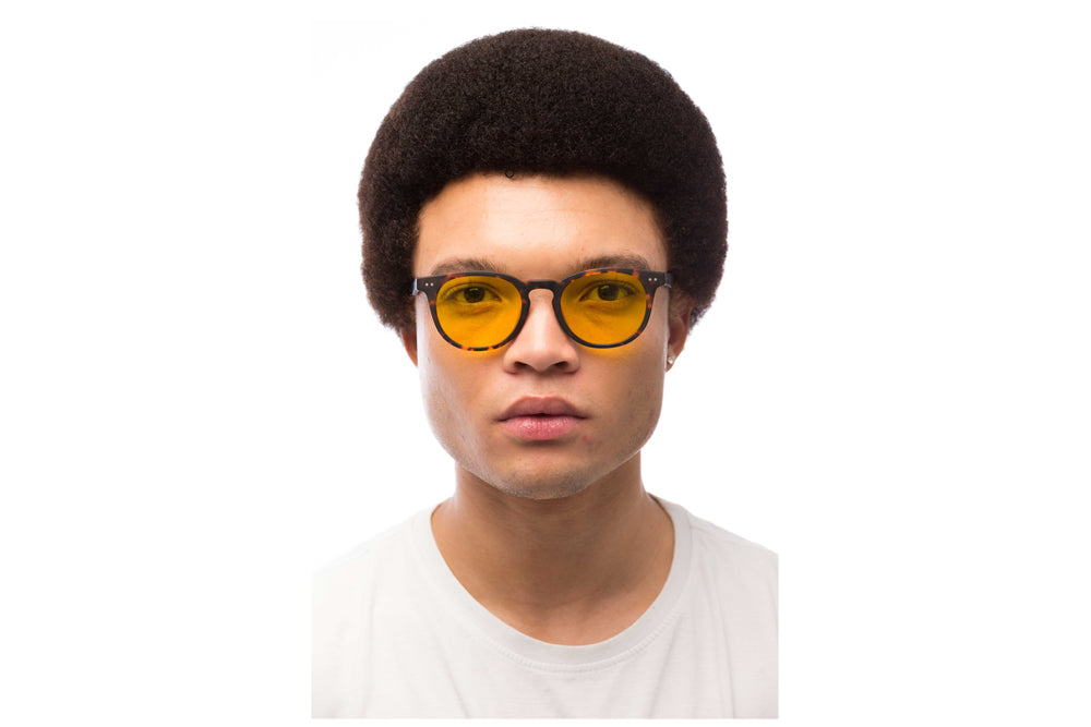 Man Wearing Clarke Light Sensitivity Glasses Readers
