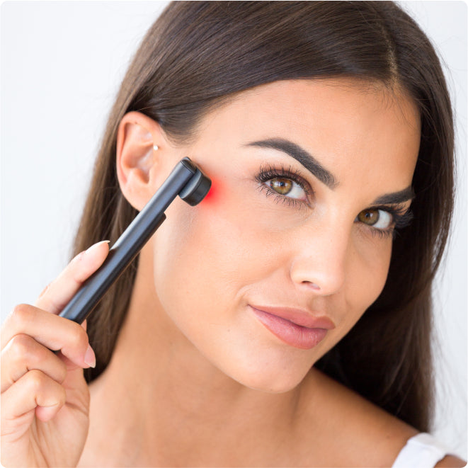  Woman Using Red Light Face Wand