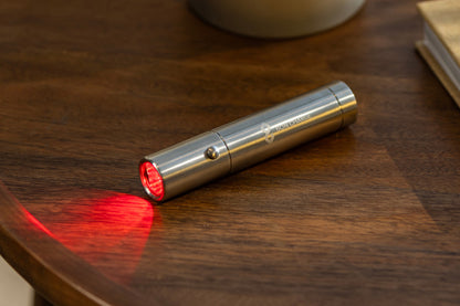 The Bullet Red Light Therapy Device On Table