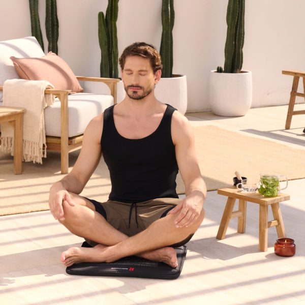 Man Sitting On Infrared PEMF Mat Mini 