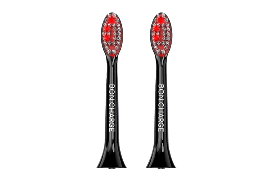 Black electric toothbrush head with red bristles