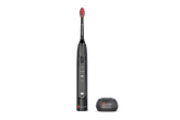 Black electric toothbrush with red bristles next to toothbrush holder