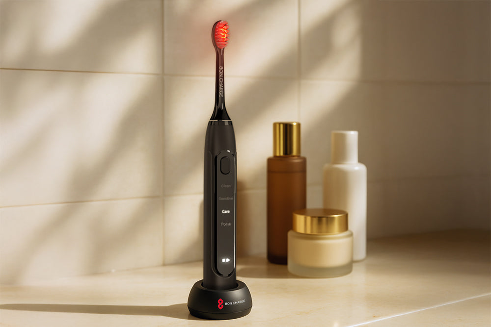 Black electric toothbrush on a stand with skincare products in the background